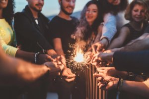 People holding sparklers